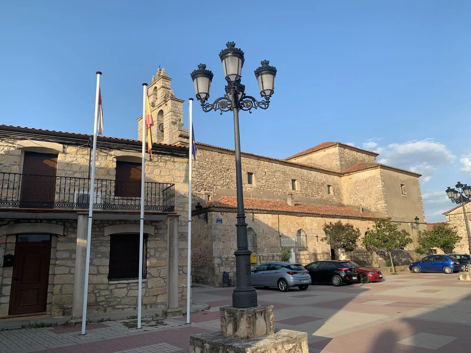 Sacecorbo’s Plaza Mayor with the town hall’s stone façade and the church tower behind.