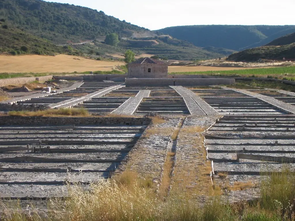 Evaporation beds and historical installations at Saelices de la Sal saltworks.