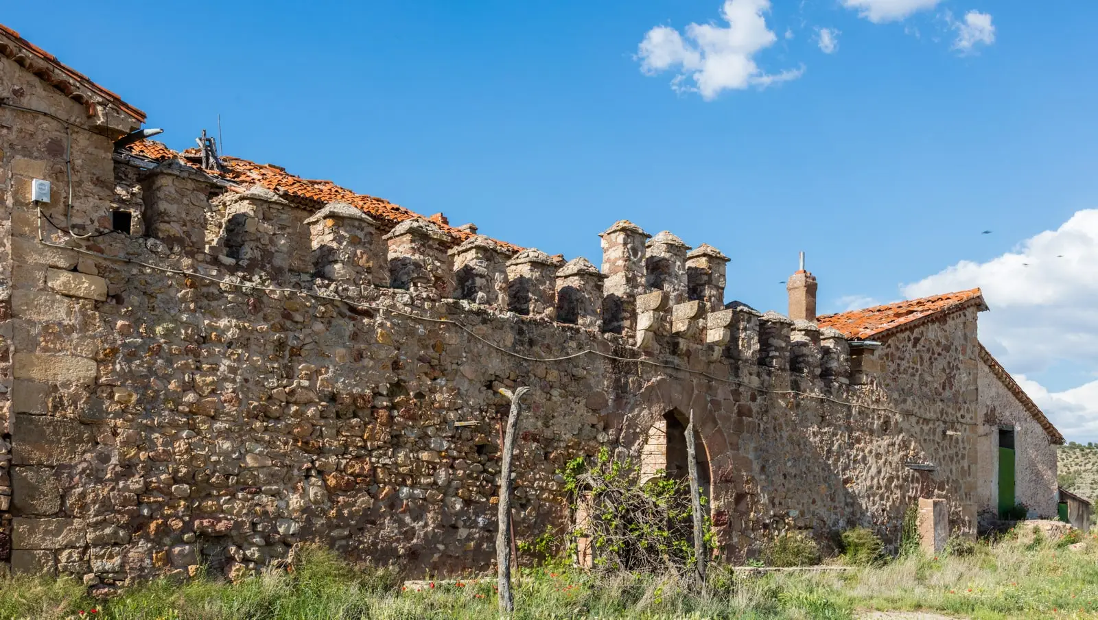 Stone façade of the Vega de Arias fortified house in Tierzo.